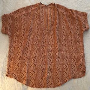 Burnt orange aztec style v-neck top